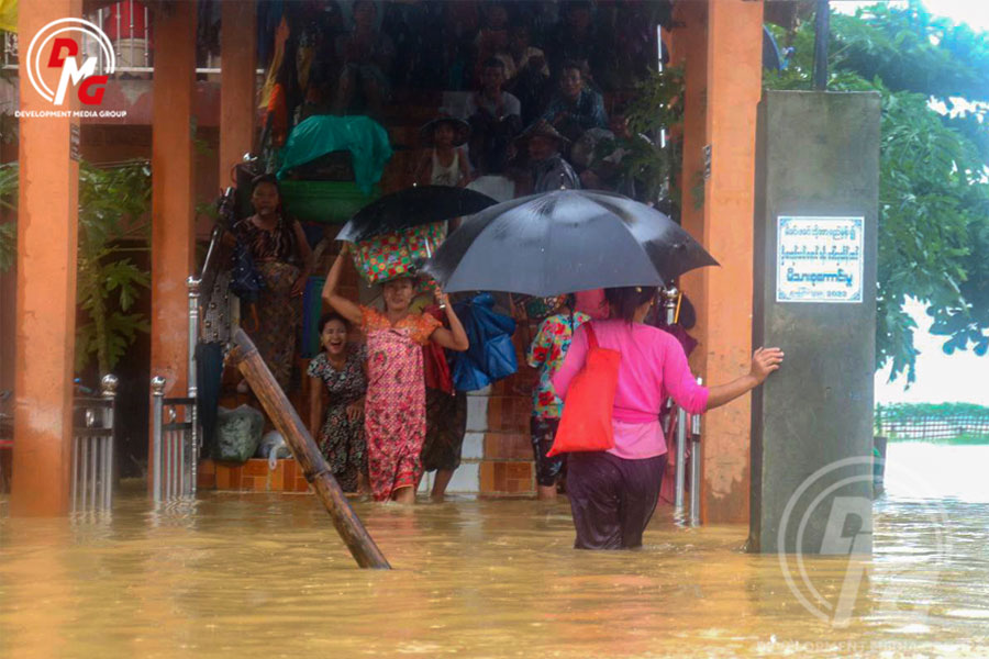 Nyaung Chaung villagers evacuate their homes on August 8, 2023, amid floods.