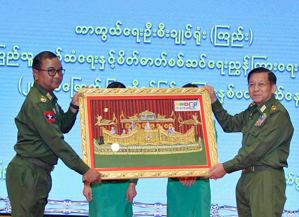 Junta boss Min Aung Hlaing and spokesman Zaw Min Tun at the 28th anniversary of the Myanmar military’s media mouthpiece Myawaddy. (Photo: cincds)