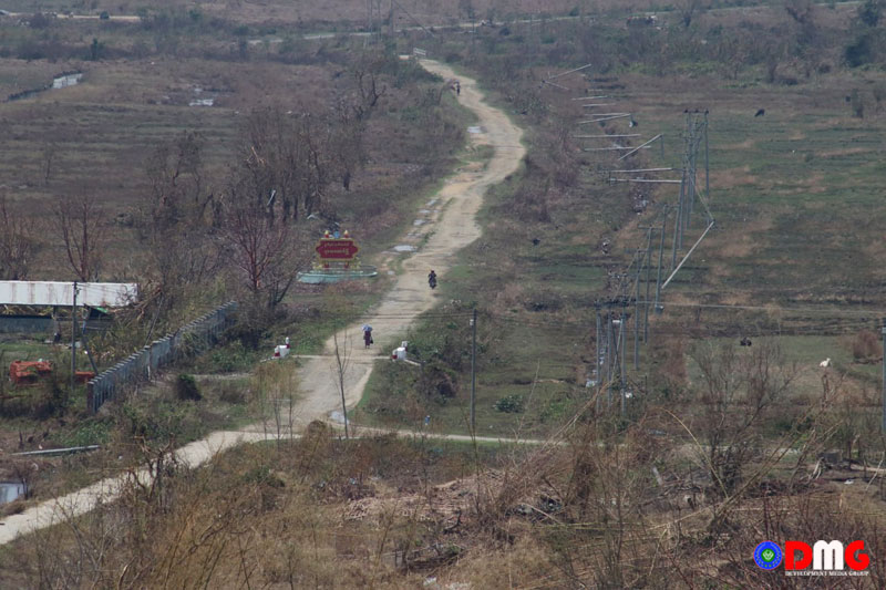 Electricity poles that were blown down by Cyclone Mocha along the Rathedaung-Buthidaung road pictured on May 18, 2023.