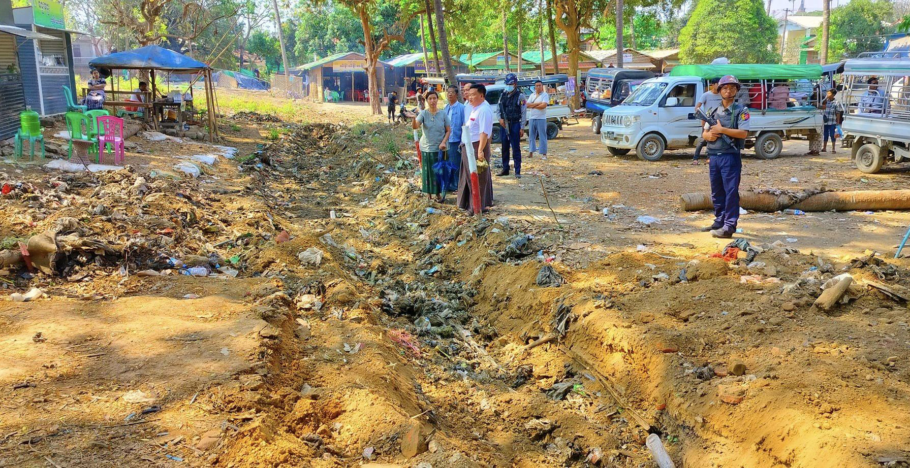 Conservation group dredges blocked drainage channels at Mrauk-U’s ancient palace mound