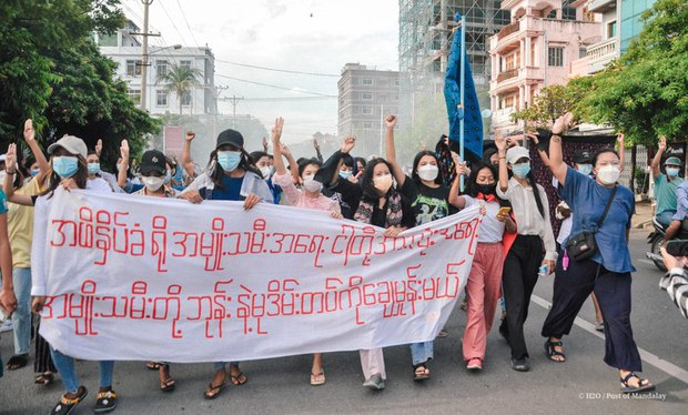 Female protesters stage a protest against military rule in Mandalay in 2021.