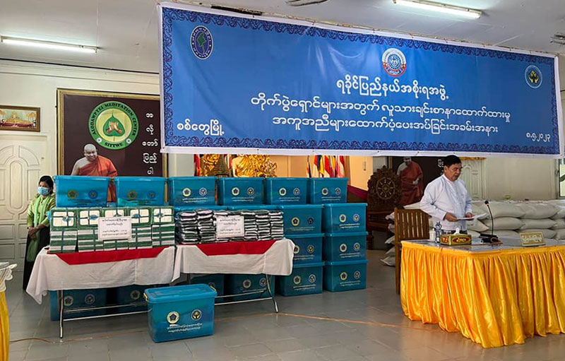 Junta officials provide relief items to IDPs on May 8. (Photo: Thi Kyar Say Chin Ngwe Thazin / Facebook)