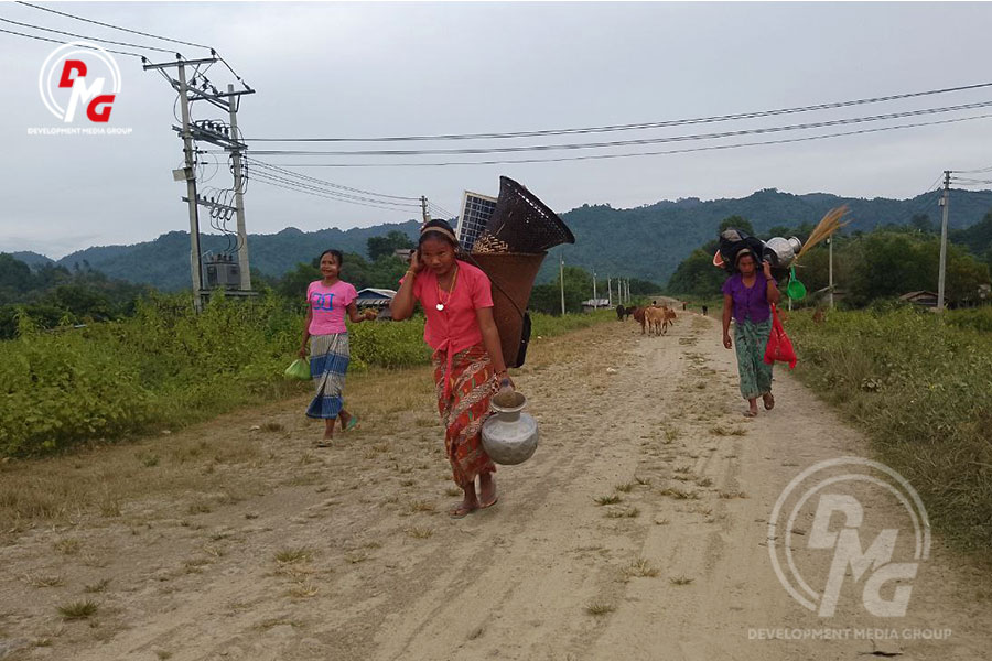 Maungdaw residents flee their homes on November 14, 2023.