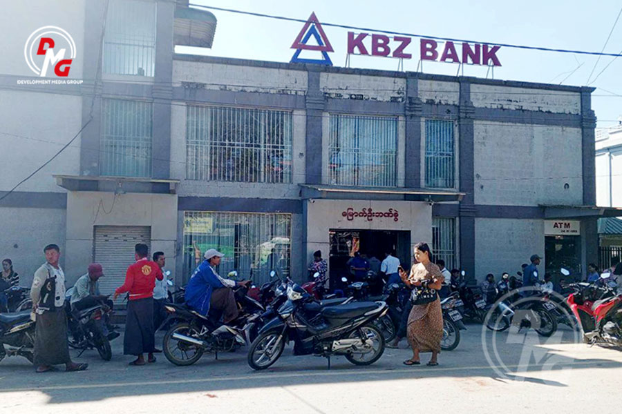 People withdraw money at a KBZ Bank branch in Mrauk-U on November 28.
