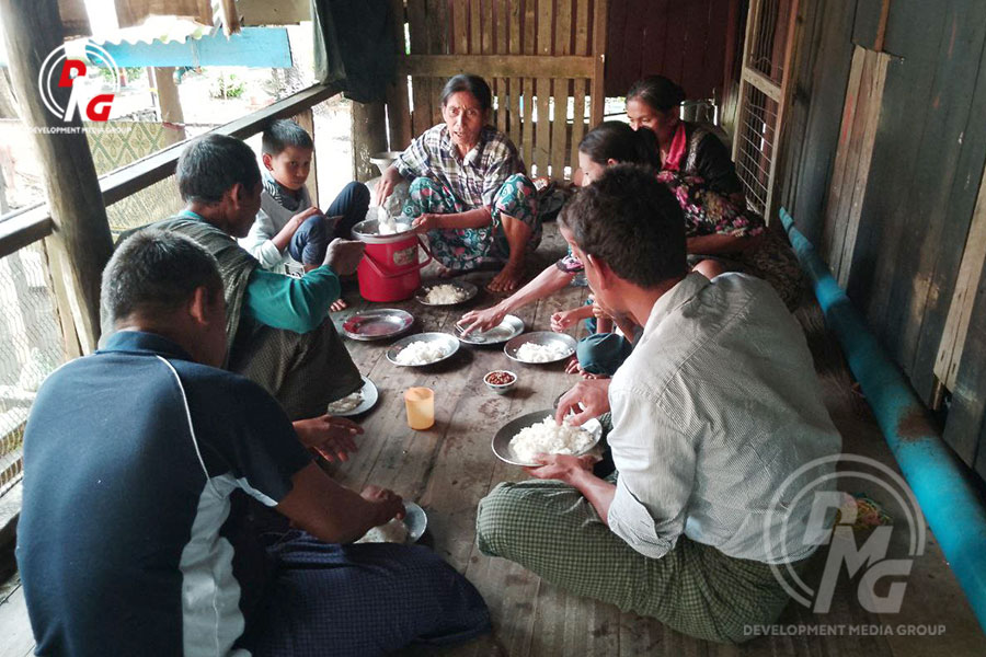An IDP family having a meal in Pauktaw is pictured on November 17.
