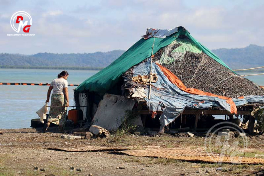 Local residents' houses in front of buildings of a Chinese oil pipeline project on Madae island in Kyaukphyu.