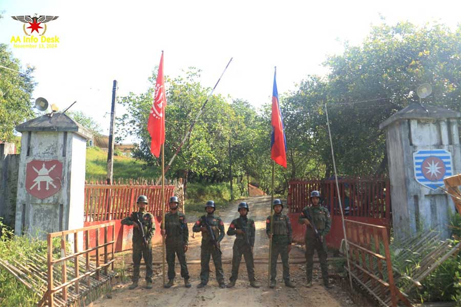 Arakkha Army (AA) combatants are seen in front of a seized military camp in Ann Township, Arakan State. (Photo: AA Info Desk)