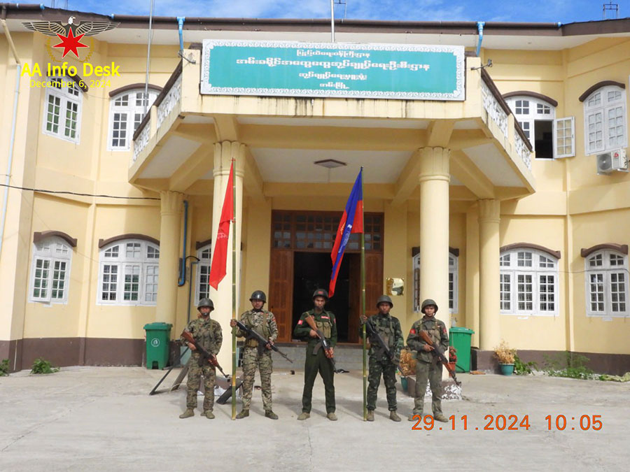 AA combatants are seen in front of the district General Administration Department office in Ann. (Photo: AA Info Desk)