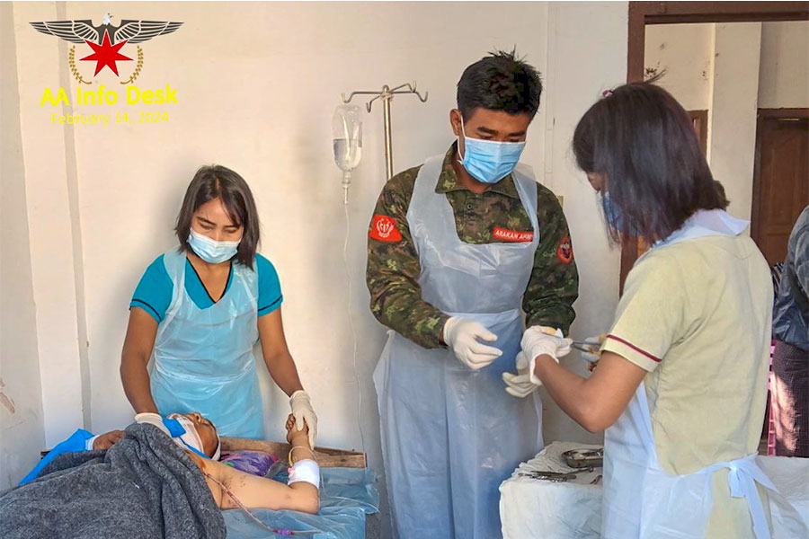 AA medics treat an injured prisoner of war caught during the battle for Kyauktaw. (Photo: AA Info Desk)