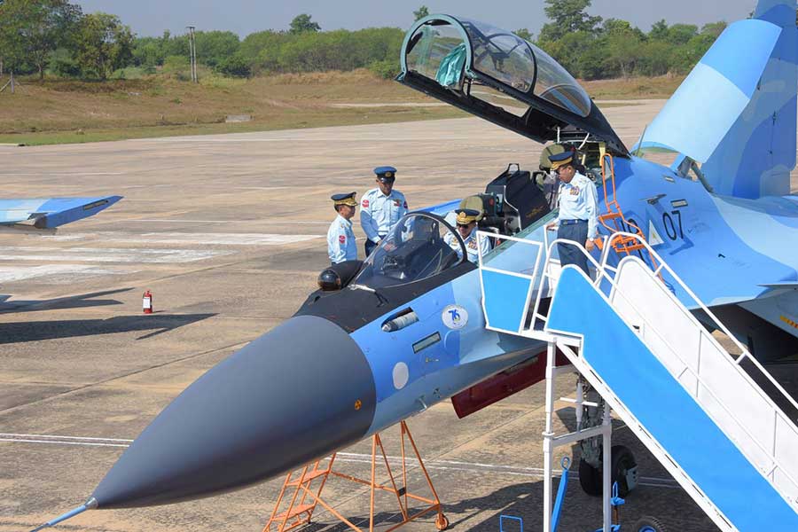 Junta boss Min Aung Hlaing inspects a jet fighter at an event for the Myanmar Armed Forces. (Photo: CINCDS)