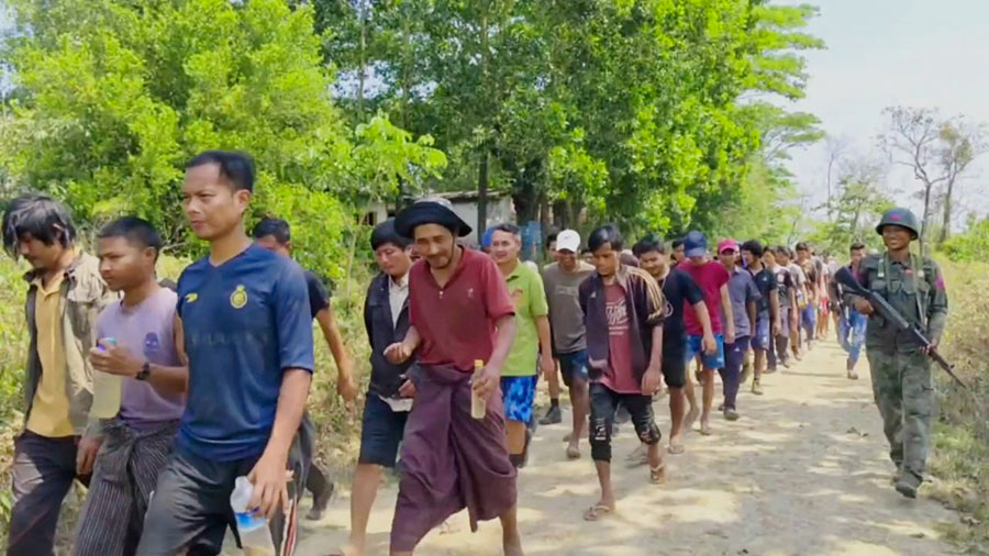 Scores of junta soldiers from the Tamanthar police outpost in Maungdaw Township, Arakan State, surrendered to the Arakan Army on March 25. (Photo: AA Info Desk)