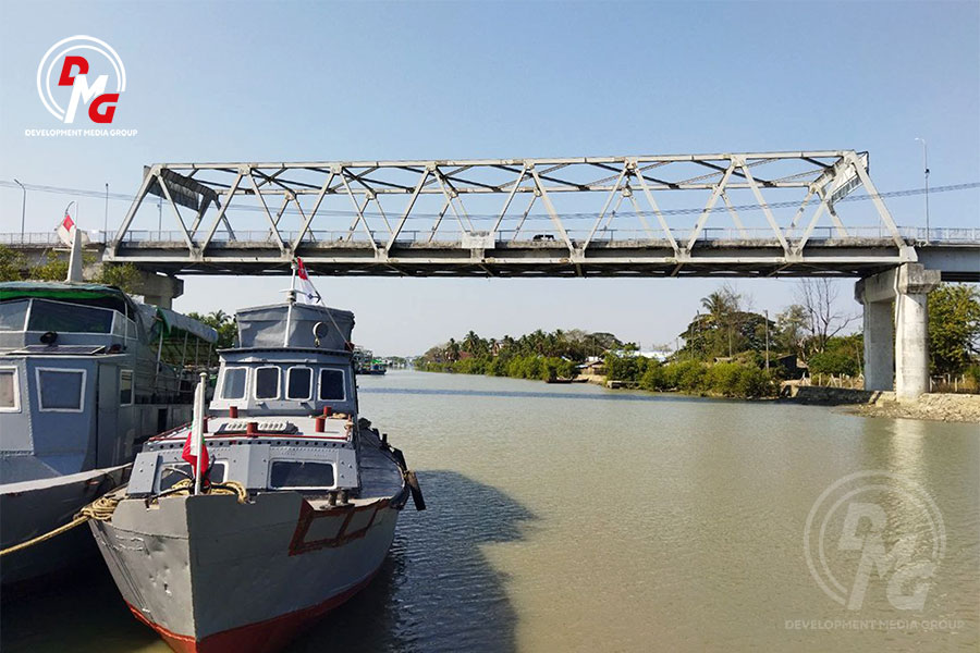 Military patrol boats are seen under the Sat Yoe Kya Bridge in Sittwe in January 2023.
