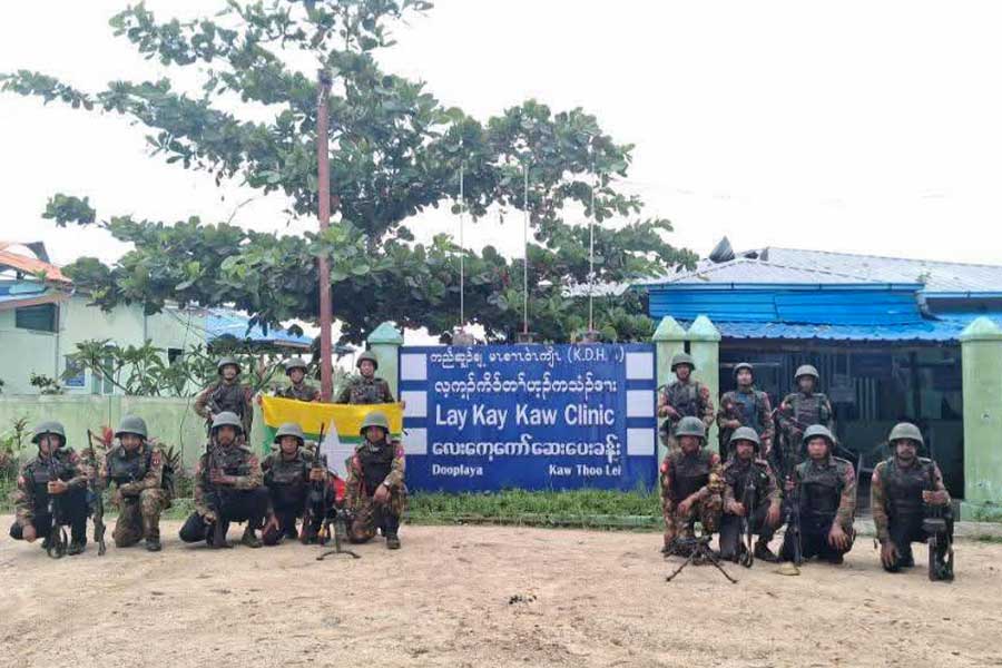 Junta soldiers are seen in front of a clinic in Lay Kay Kaw Myothit in the first week of October. (Photo: Junta lobby channel)